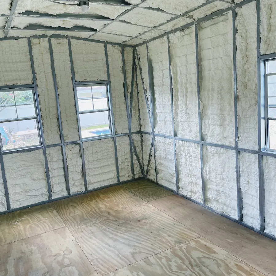 Closed-cell spray foam insulation applied to wall cavities in a residential project in Lehigh Acres